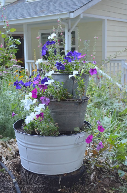 metal containers stacked and planted as a vertical planter