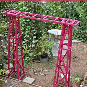 DIY garden arbor made from obelisks, with text overlay, DIY Garden arbor, easy to build and budget friendly, Flower Patch Farmhouse