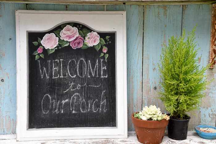 Cabinet door painted as a framed chalkboard with pink roses, DIY frames from cabinet doors. 