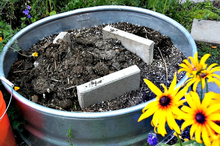 fire ring with concrete pavers, step by step to build a planter with solar fountain