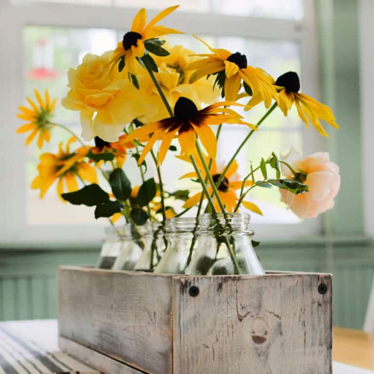 Fall flowers in a diy rustic crate on table