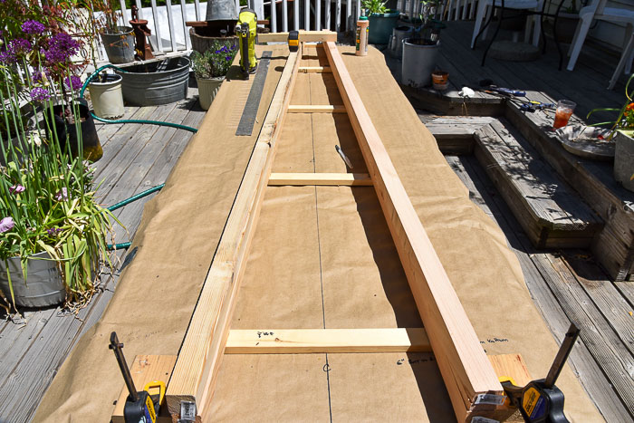 lumber laid out to build DIY obelisk tomato support