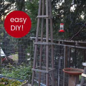 DIY tomato cage in garden with text overlay, practical meets pretty, easy DIY tomato cage, FlowerPatchFarmhouse.com