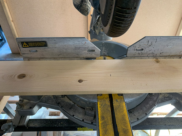 cedar fence board to be cut with miter saw