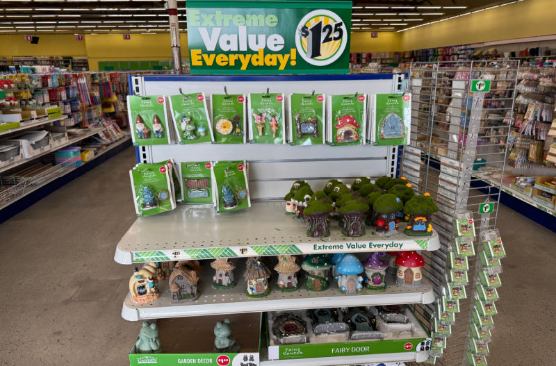 shelf of fairy garden accessories at dollar tree