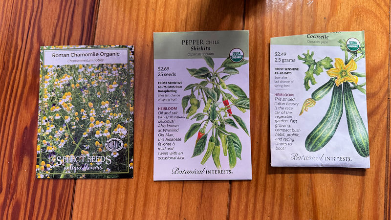 organic packets of seeds on wood floor